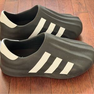 Adidas Men's Black and White Slip-On Sneakers